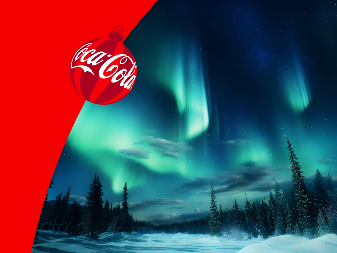 coca-cola ornament overlaying aurora borealis