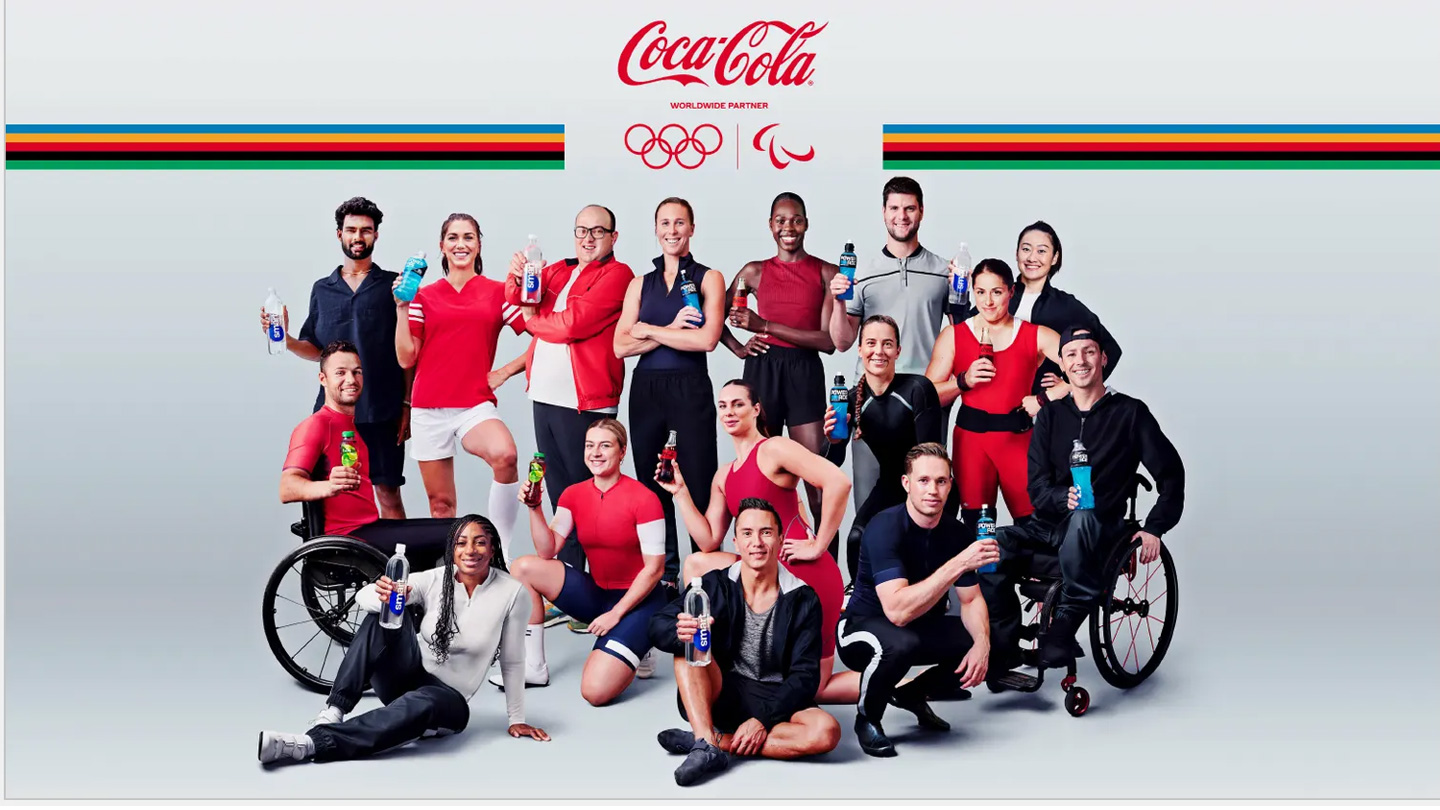 group of Olympic and paralympic athletes holding different coca-cola products.