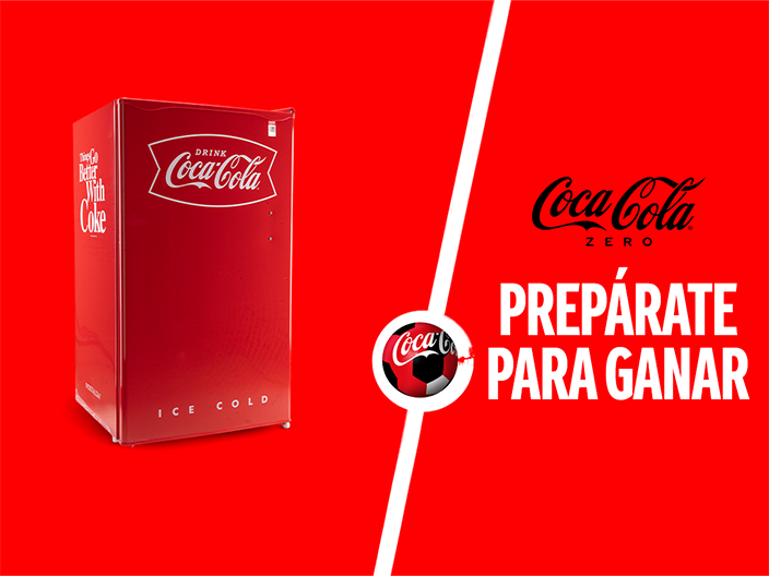 Fotografía de una mini nevera sobre un fondo rojo. A la derecha el logo de "Coca-Cola Zero" y debajo la frase "Prepárate para ganar"