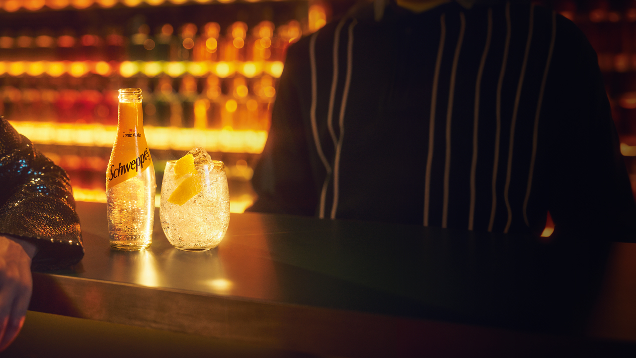 Photo of Schweppes cocktail on a bar counter