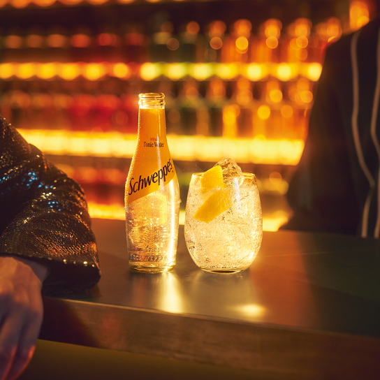 Photo of Schweppes cocktail on a bar counter