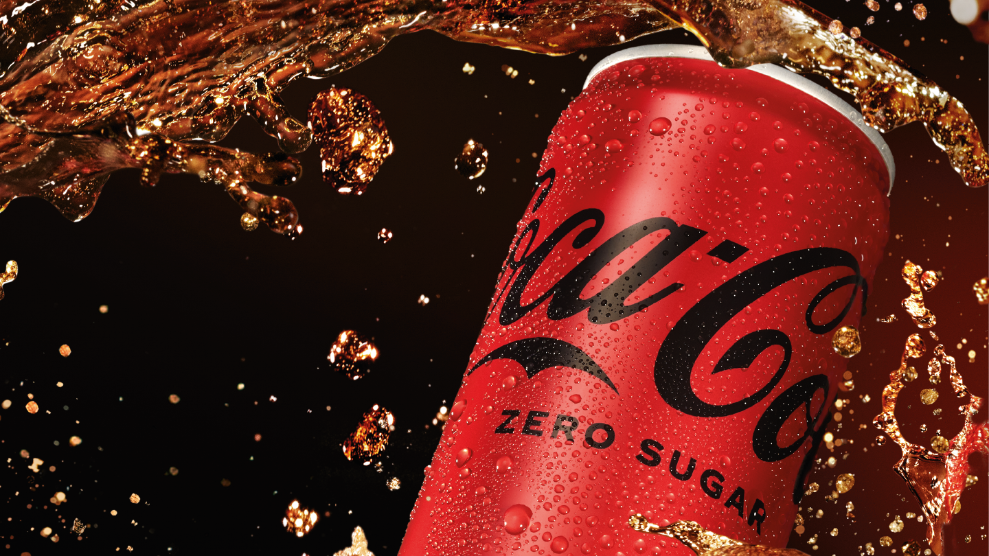 Coca-Cola Zero Can with liquid swirling around it