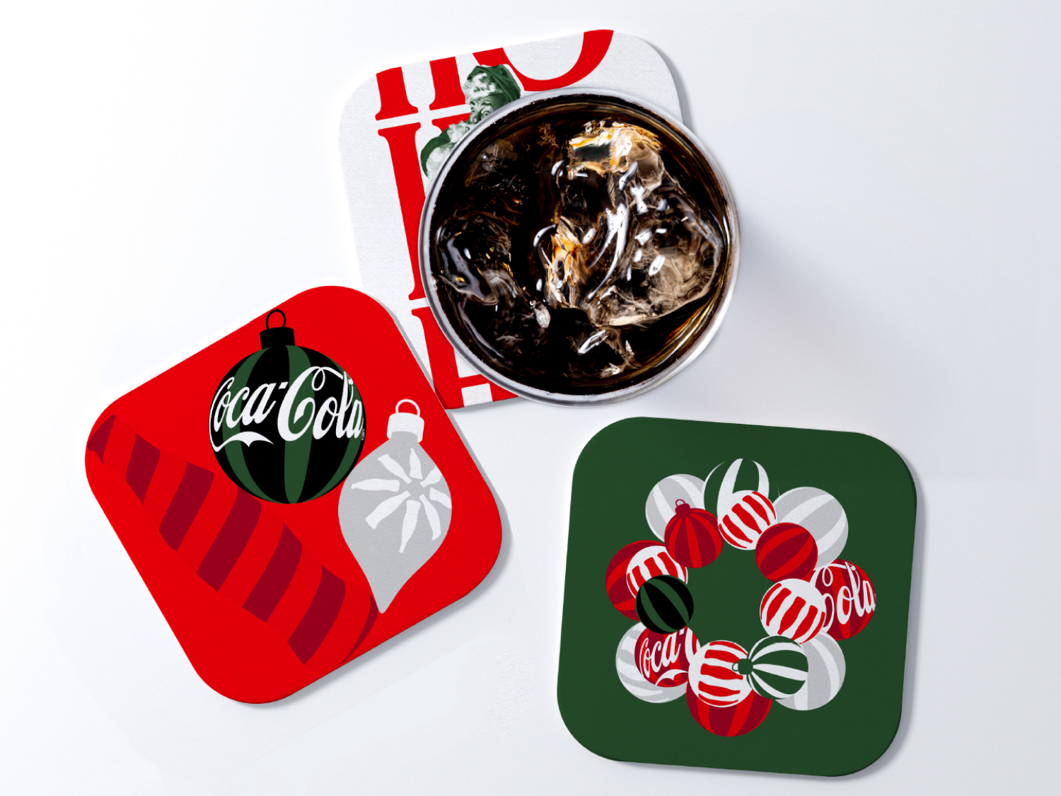 A glass of Coca-Cola with ice on the festive coaster