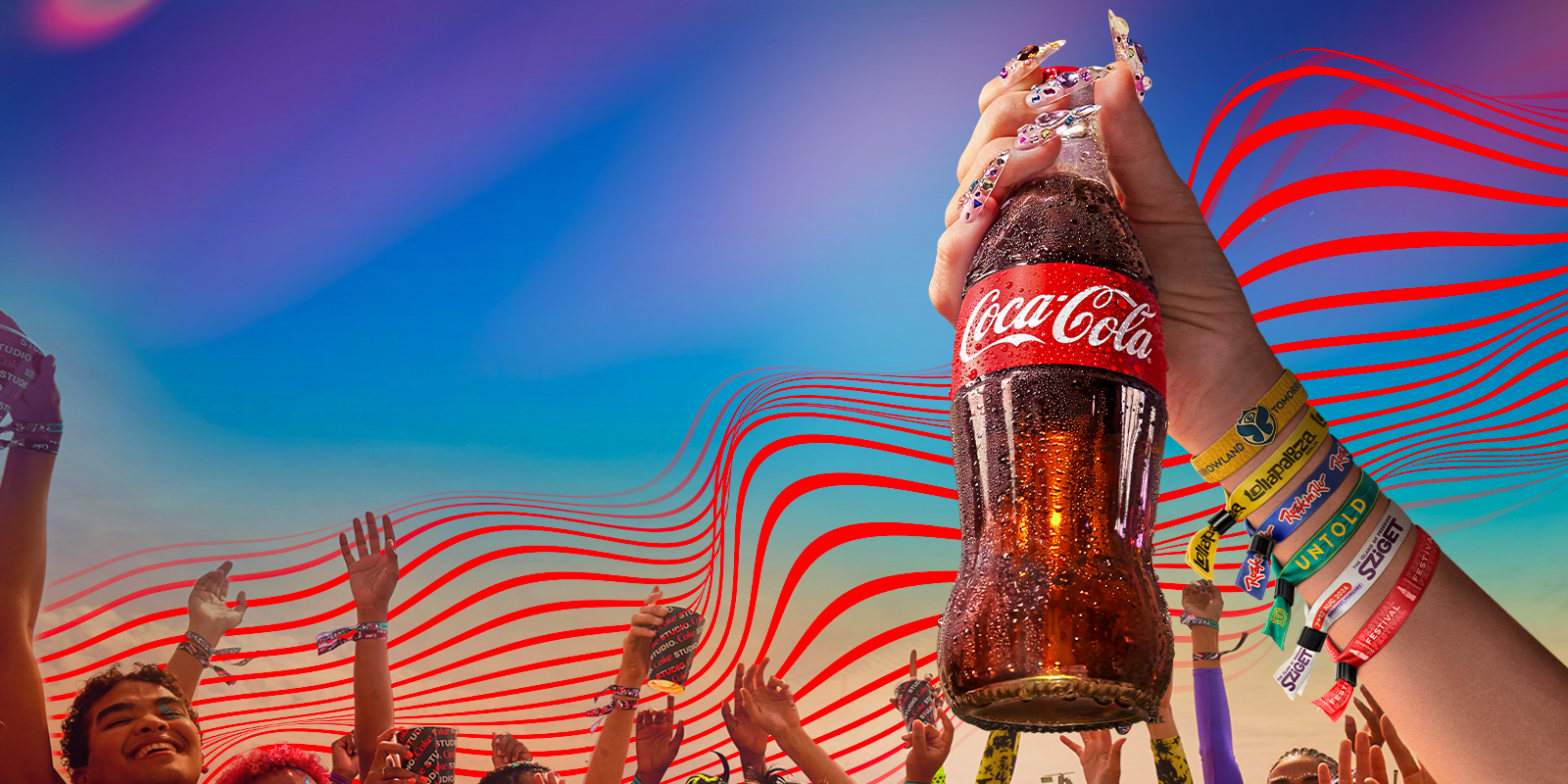 hand holding a bottle of coca-cola with festivals wristbands