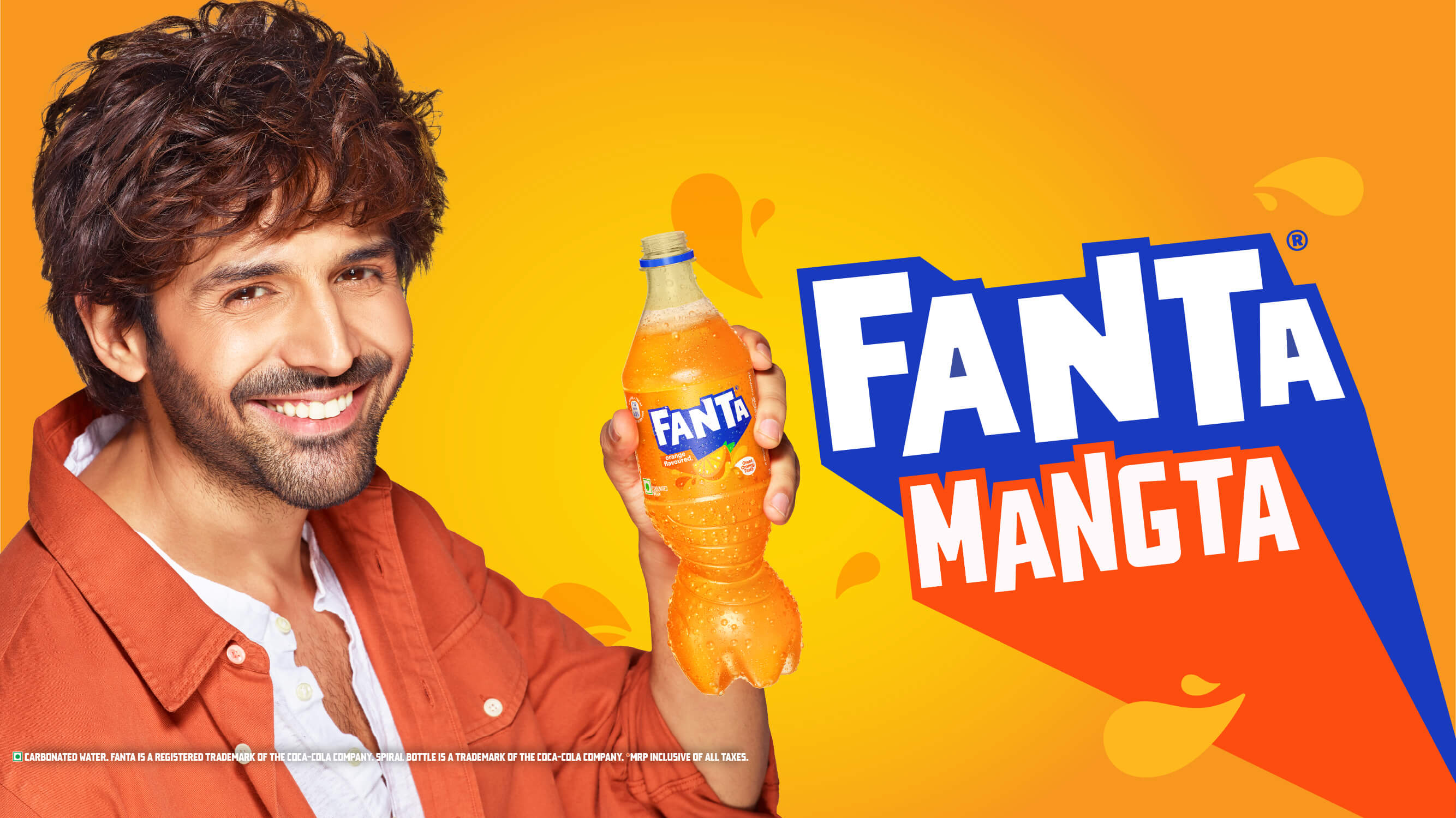 Young man enjoying a Fanta Apple Delite in a crowd with the words: NEW FANTA APPLE DELITE WITH REAL APPLE JUICE. ISS DRINK MEIN APPLE KI BITE HAI.