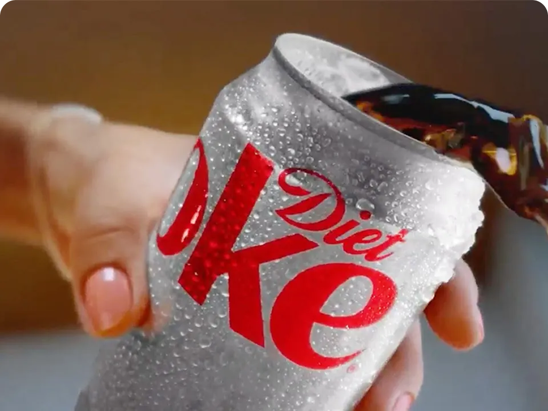 A can of cold Diet Coke being poured