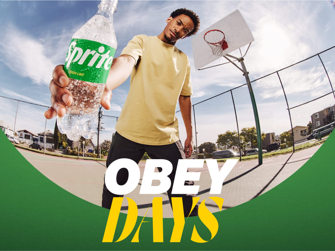 Sprite Obey Days man holding out a sprite while standing on a basketball court outside