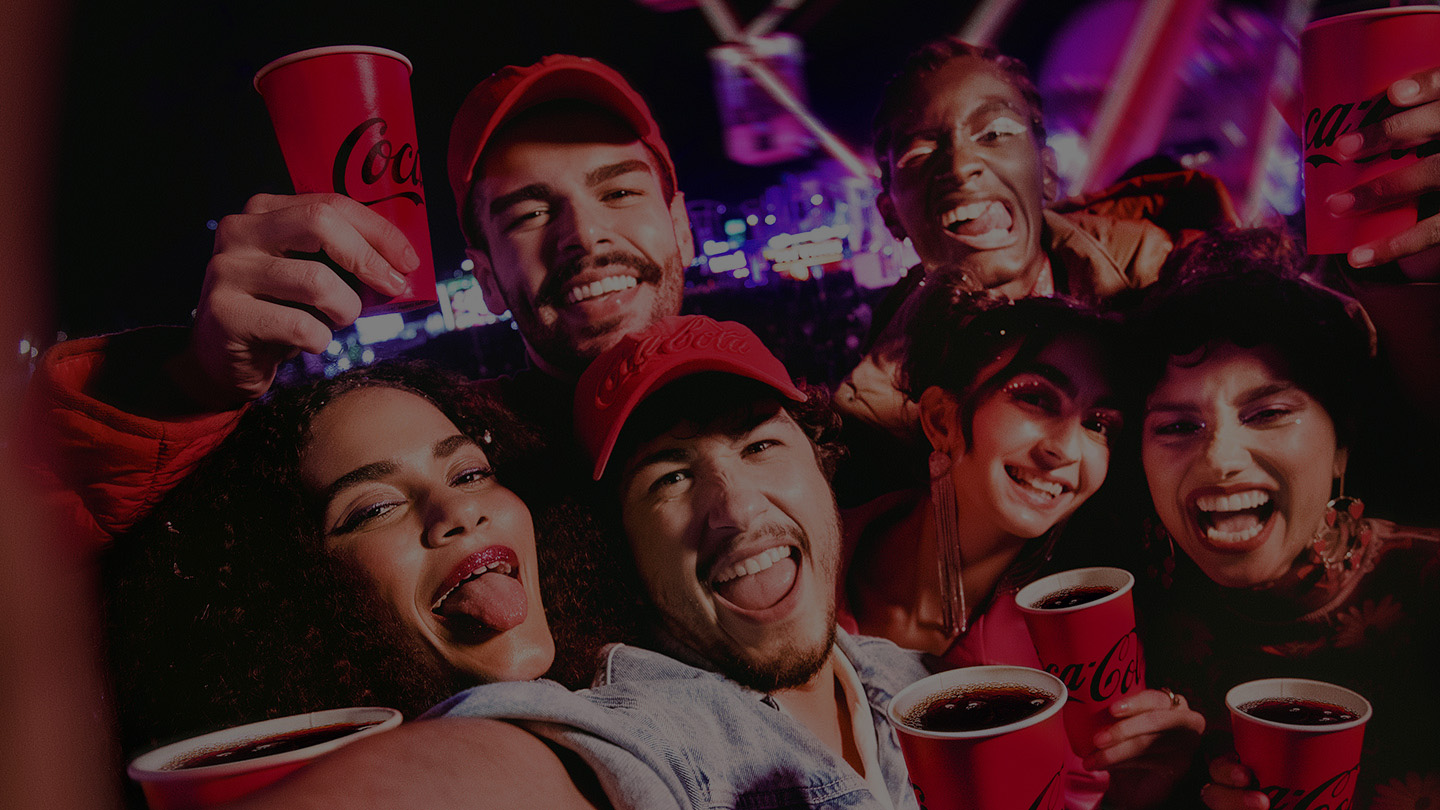 friends taking a selfie with Coca-Cola