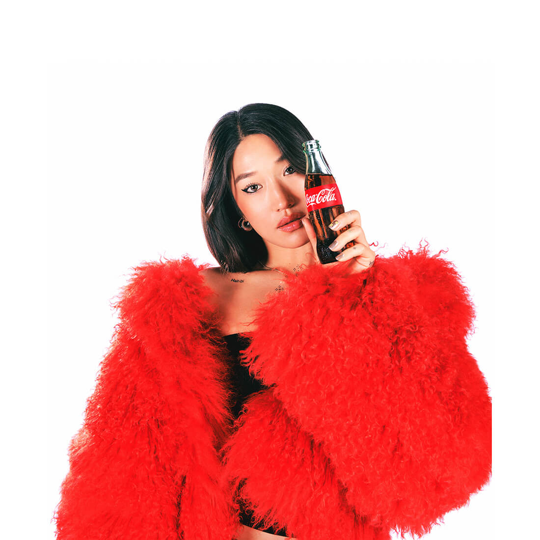 Peggy Gou with bottle of Coke