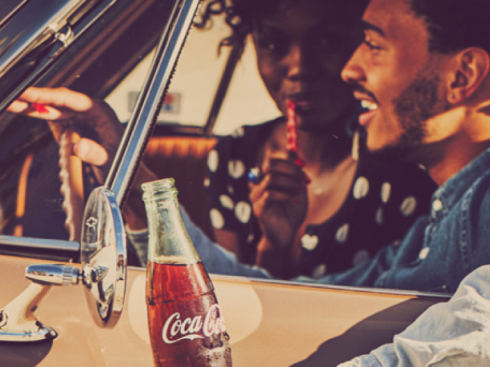 drinking coca-cola in car