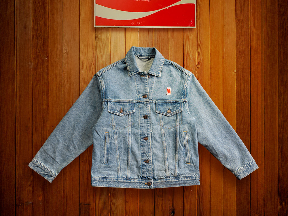 A denim jean jacket with the diet coke logo