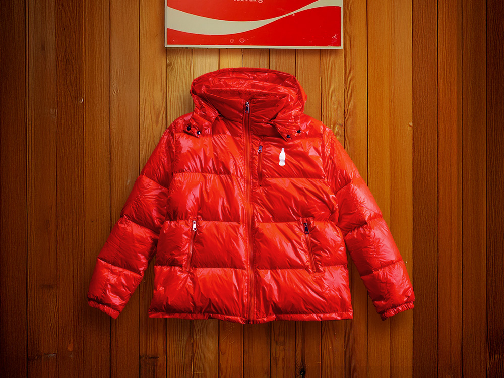 A red puffer jacket with the Coca-Cola logo