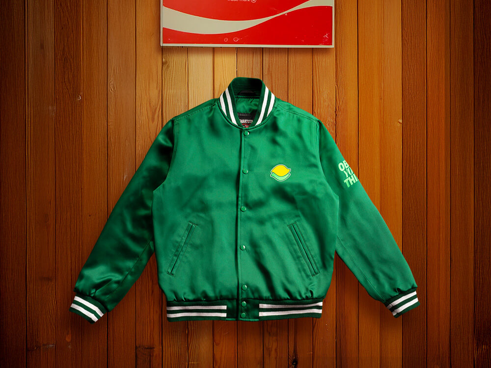 A green bomber jacket with the Sprite logo