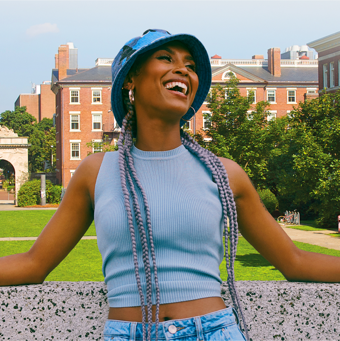 Woman standing outside on a sunny day smiling 