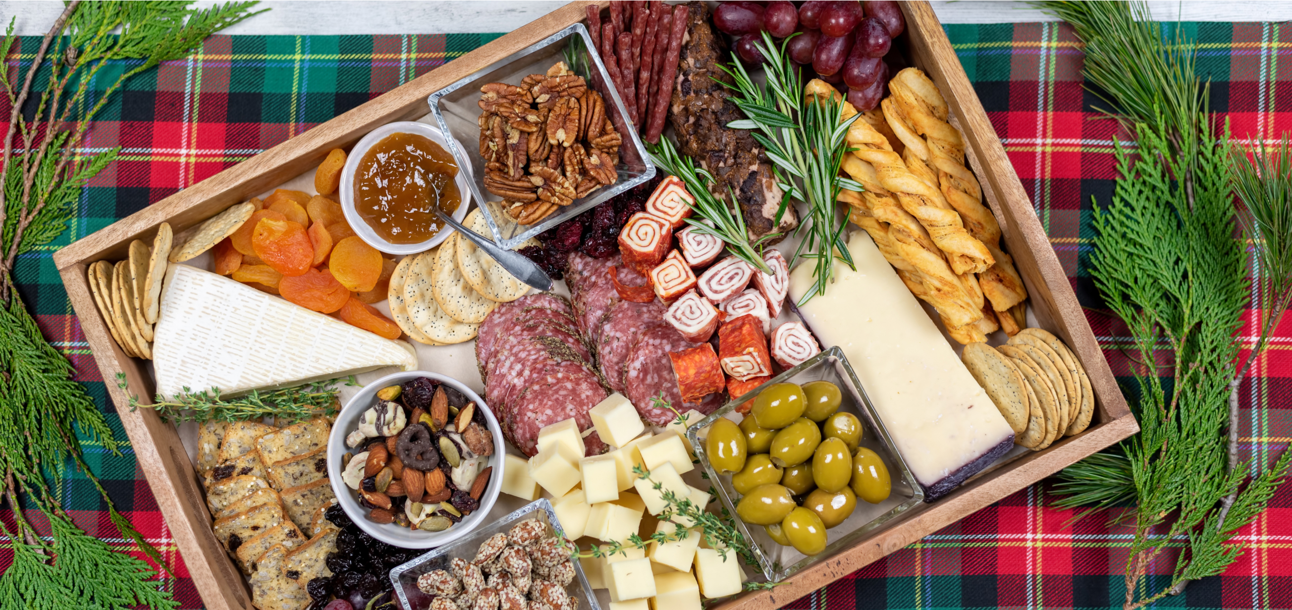 charcuterie board on plaid cloth